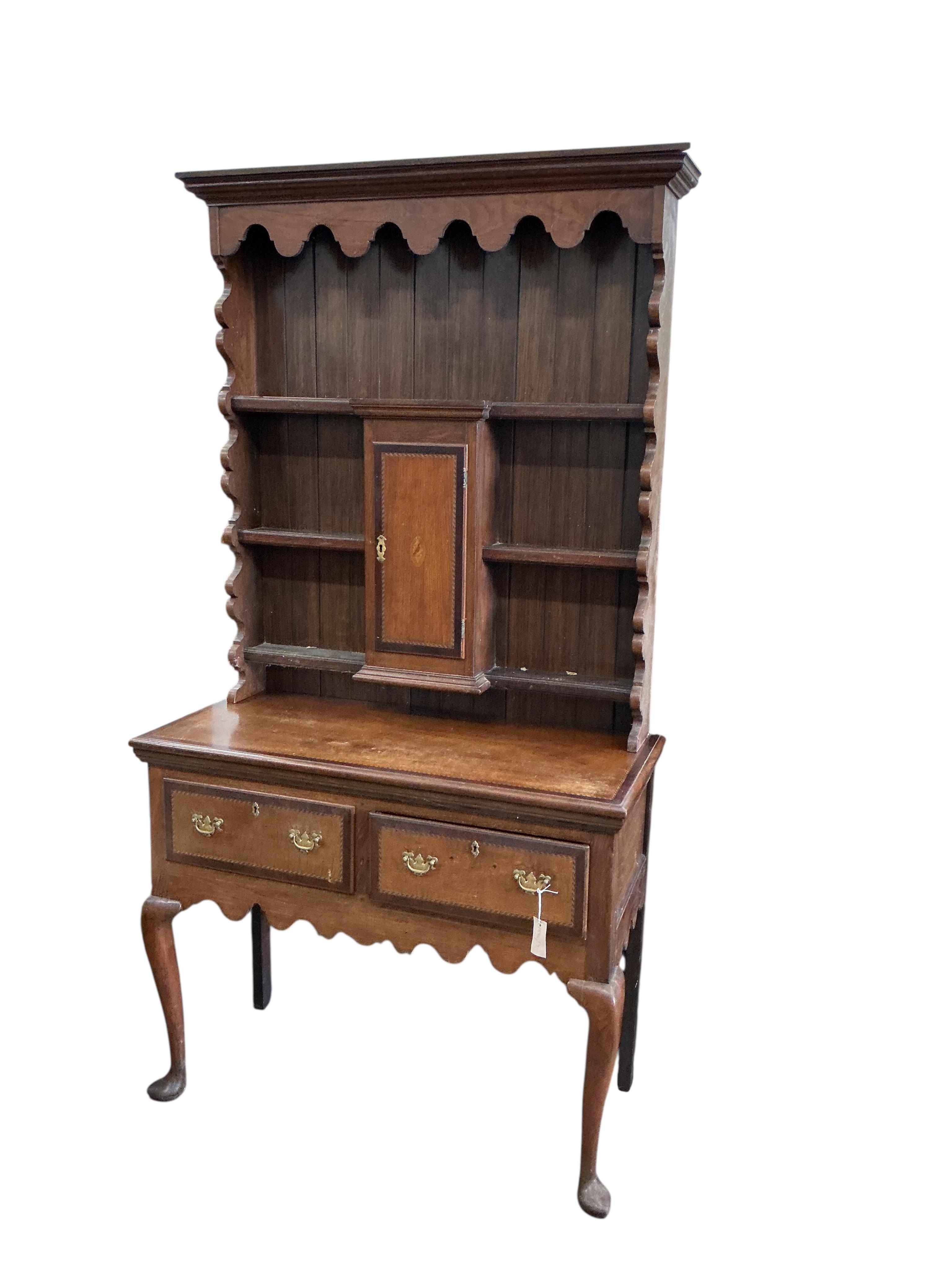 An early 20th century inlaid oak narrow dresser, width 104cm, depth 46cm, height 198cm